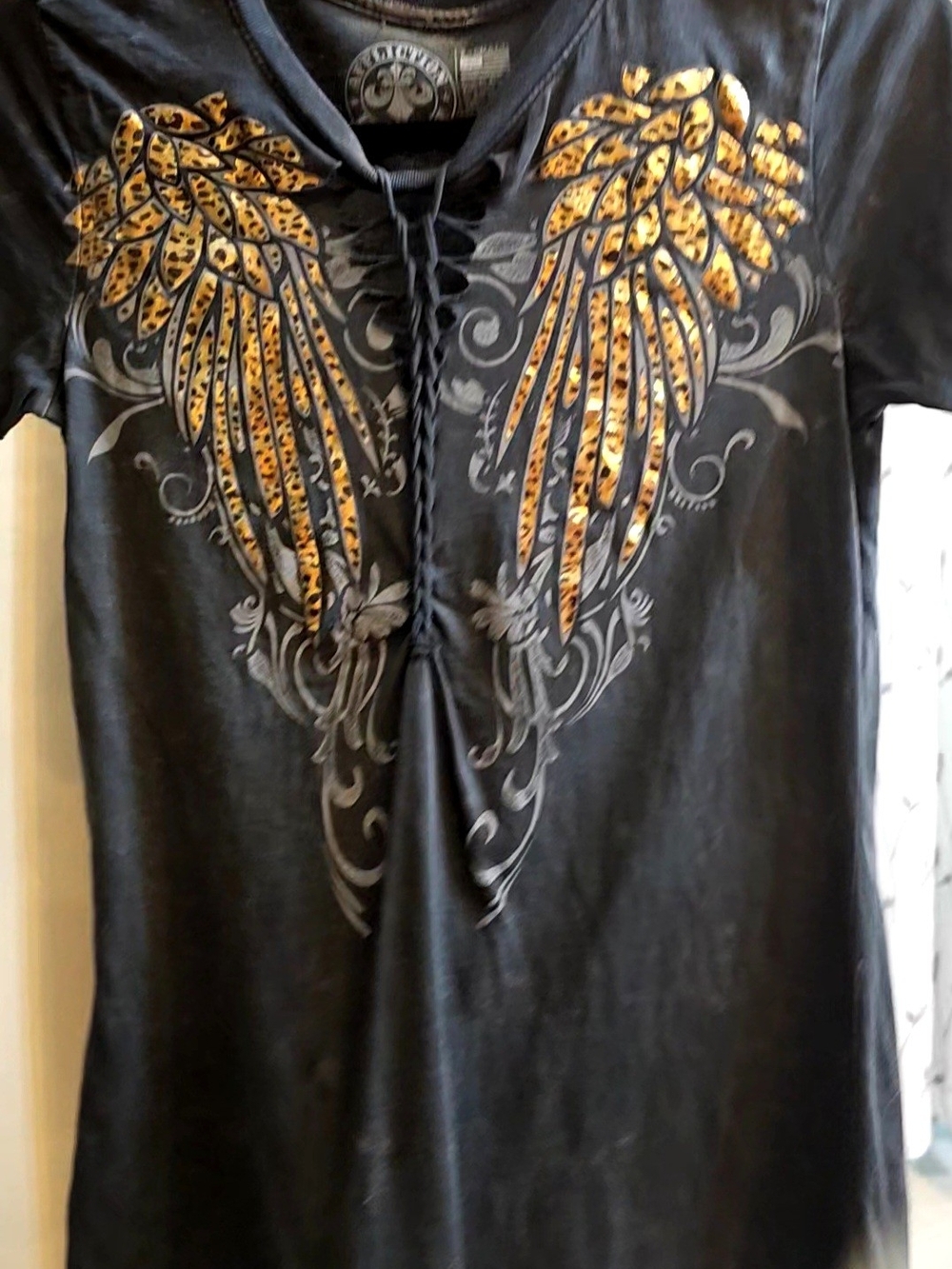 Affiction Black Lace-Up Tee with Leopard Wing Gold Foil Graphic XS